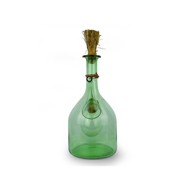 This vintage hand-blown green glass chiller decanter (or porrón) is a charming marriage of rustic Mediterranean tradition...