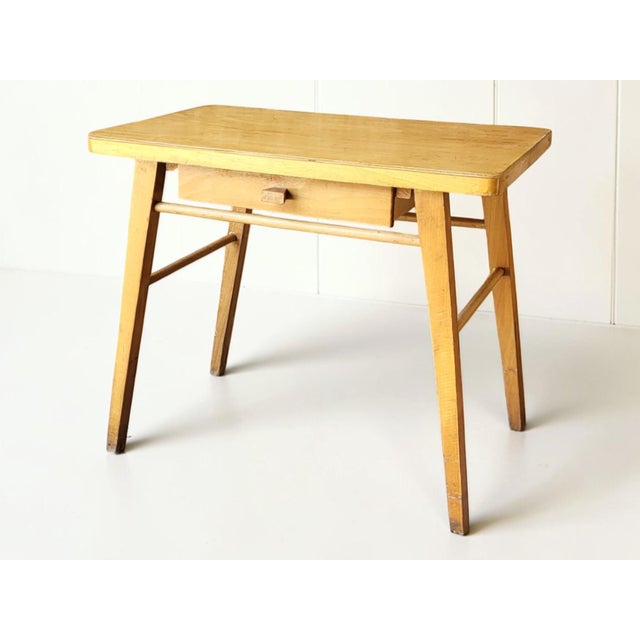 Children's desk by Baumann. Desk height: 50 cm / Dimensions: 39 x 59 cm Chair height: 57 cm / Seat height: 30 cm In good...