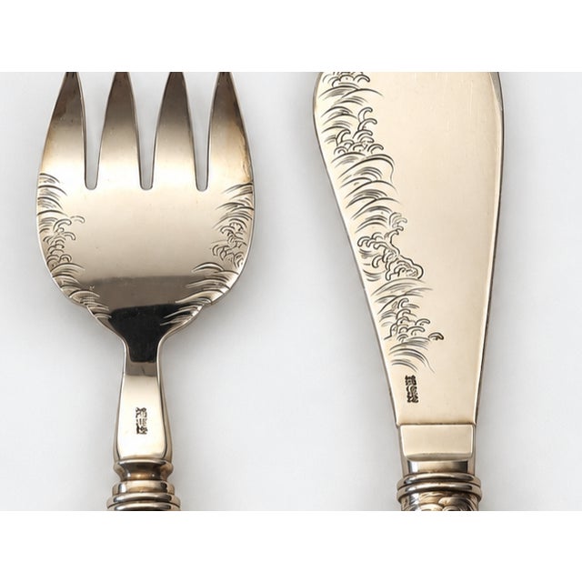 Exceptional Japanese Fish Serving Set. Bright cut chased pattern on blade and tines, hand chased "Dragon" motif on...