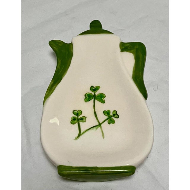 Charming (and lucky?) this hand painted ceramic trinket dish is shaped like a teapot and features green shamrocks. Signed...
