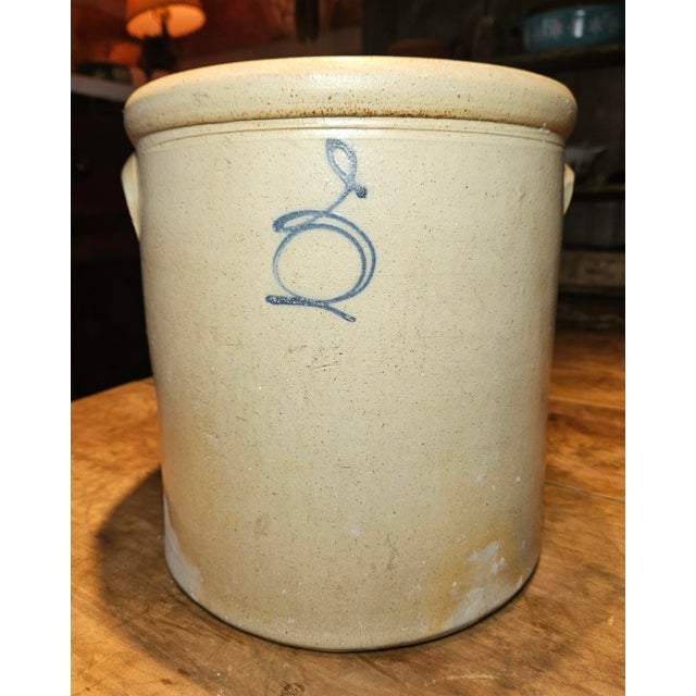 This beautiful antique salt-glazed stoneware was likely made by Red Wing Pottery in the late 19th century. It features a...