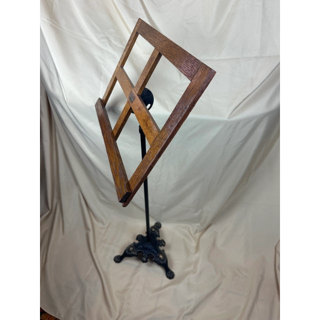 This is a stunning antique oak and iron adjustable music stand from the late 1800s to early 1900s. The music rack is made...