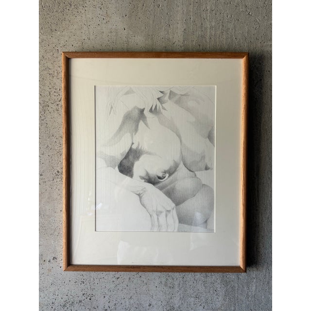 An expressive late 20th century graphite portrait depicting a reclining nude female figure, executed with confident hand-...