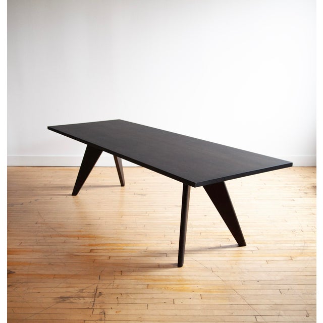 Large Vitra Solvay Table originally designed by Jean Prouve. Also known as the Table S.A.M. Bois. Dark oak finish....