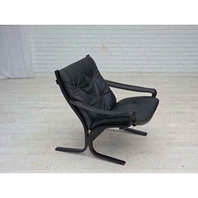 1970s, Norwegian design by Ingmar Relling, model "Siesta". Original brown furniture leather, bent dark beech wood, canvas....