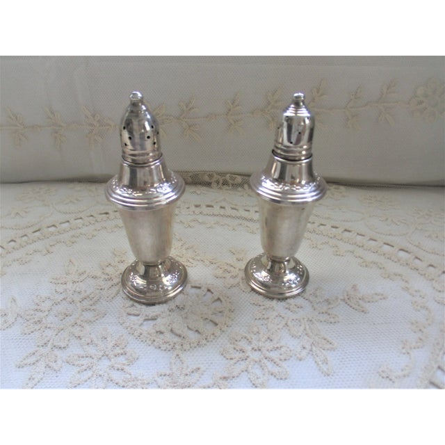 This is a Pair of Vintage Garden Silversmiths LTD Weighted Ornate Sterling Silver Salt and Pepper Shakers that are 5" tall...