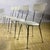 This refined set of four dining chairs perfectly embodies the rationalist and light taste of midcentury style. With their...
