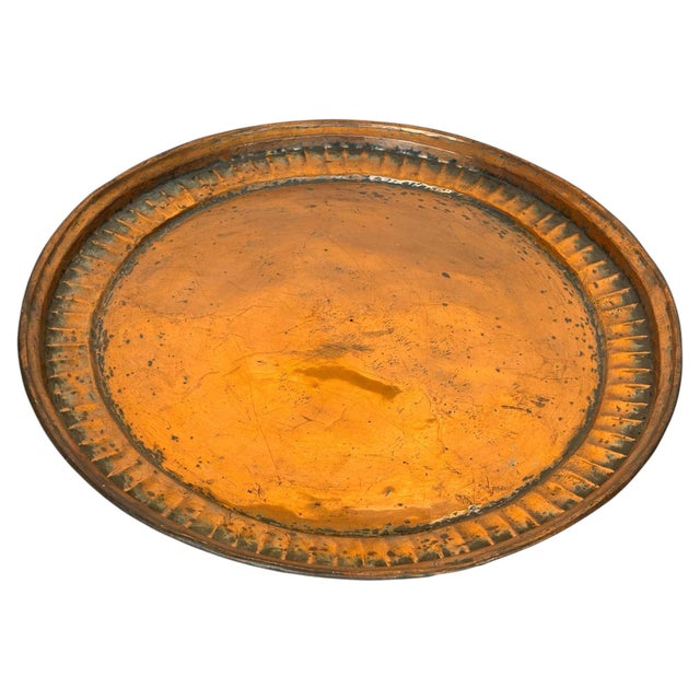 Large antique hand-hammered copper tray with a warm, richly aged patina and an impressive 22-inch diameter. This...