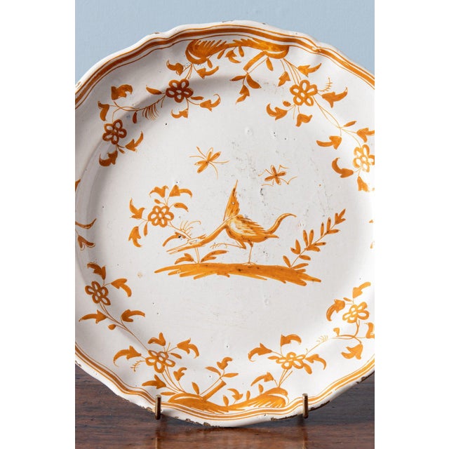 Diameter: 25 cm Height: 3 cm Some glaze losses to the edge and some wear throughout, commensurate with age Marked underneath.