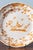 Diameter: 25 cm Height: 3 cm Some glaze losses to the edge and some wear throughout, commensurate with age Marked underneath.