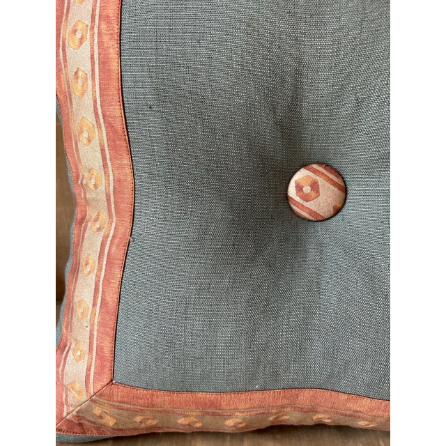 A pillow made with linen and trimmed and tufted with Fortuny’s iconic printed fabric, down inserts are included