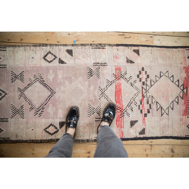 :: Center covered field of diamond shaped medallions in asymmetric contouring and checkered relief with abrashes and...