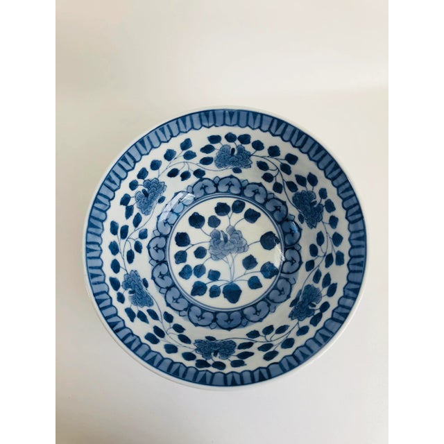 Large vintage Chinese blue and white palace size bowl decorated with large floral motif. Maker's mark on underside. Great...