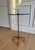 An elegant and increasingly difficult-to-find Quad Pod accent table by Global Views, featuring a sculptural iron base...