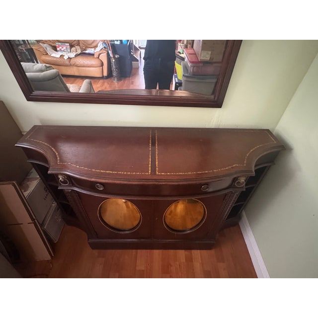 Bring a touch of Gilded Age glamour into your home with this Antique 1920s Mirrored Buffet Cabinet. A true statement...