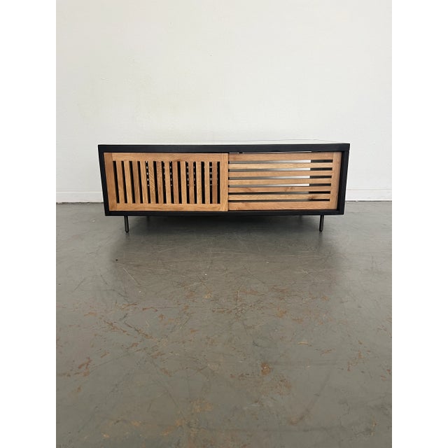 Linear-driven design. Clean casing of black mango wood frames warm natural oak, featuring both vertical and horizontal...