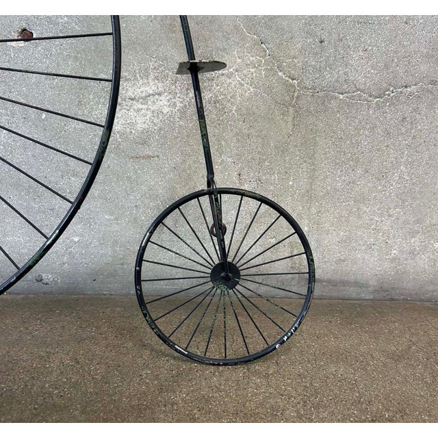 A striking vintage Curtis Jere-style penny-farthing bicycle wall sculpture, handcrafted in welded metal with a black...