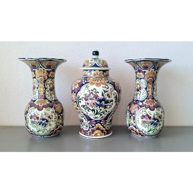 Decorative three-piece garniture set produced by Boch Frères Keramis, Belgium, circa 1950s–1970s. The set includes two...