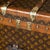 An exquisite early 20th century “malle haute“ (tall trunk) by louis vuitton. Covered in the world famous lv monogrammed...