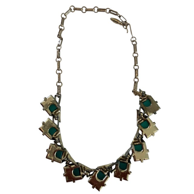 What a fabulous set! Vintage 1950’s geometric green thermoset lucite stones with gold-tone chain. The earrings are classic...
