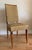 Bought from the renowned John Salibello in New York City, this striking set of six original French Art Deco dining chairs...