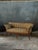 An elegant and simple period walnut Biedermeier settee. The classical design features elegant curved legs and arms in a...