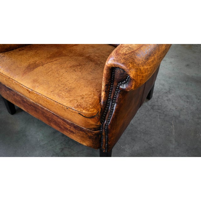1970s Vintage Art Deco Distressed Cognac Leather Wingback Chair & Ottoman For Sale - Image 15 of 16