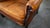 1970s Vintage Art Deco Distressed Cognac Leather Wingback Chair & Ottoman For Sale - Image 15 of 16