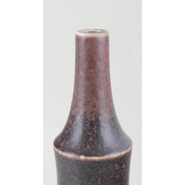 Carl Harry Stålhane for Rörstrand, Sweden. Large ceramic vase. Slender shape with a narrow neck. Glaze in brownish shades....