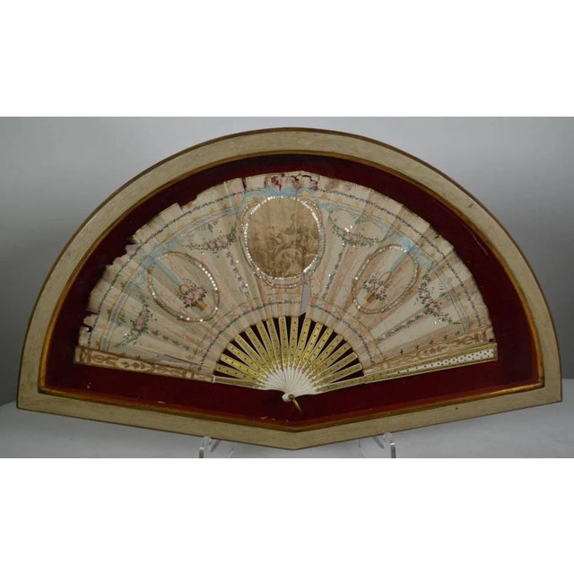 18th century hand-painted fan. (Framed) some loss on edges.