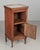 A 19th century French Country walnut side table, or nightstand, with a vertical tambour door above a cabinet door. Inset...