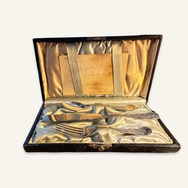 This adorable sterling child’s place setting consisting of a fork, knife, and a spoon clearly was rarely if ever used. In...