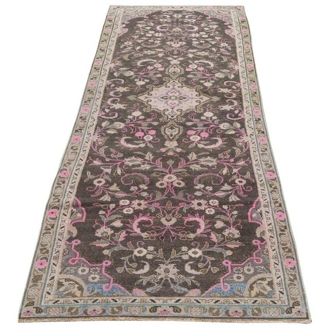 Hand-knotted with care using traditional rug-making techniques, this wool rug blends timeless craftsmanship with a modern...