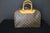 This magnificent louis vuitton bag is crafted from the iconic monogram canvas with natural calfskin trim and rolled...