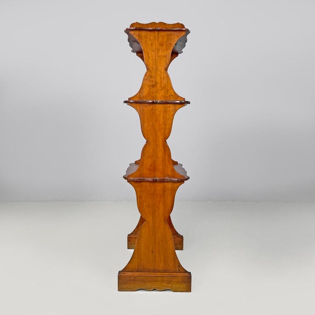 Italian Art Nouveau wooden bookshelf with three shelves, early 1900s Wooden bookcase or etagere. The structure is composed...