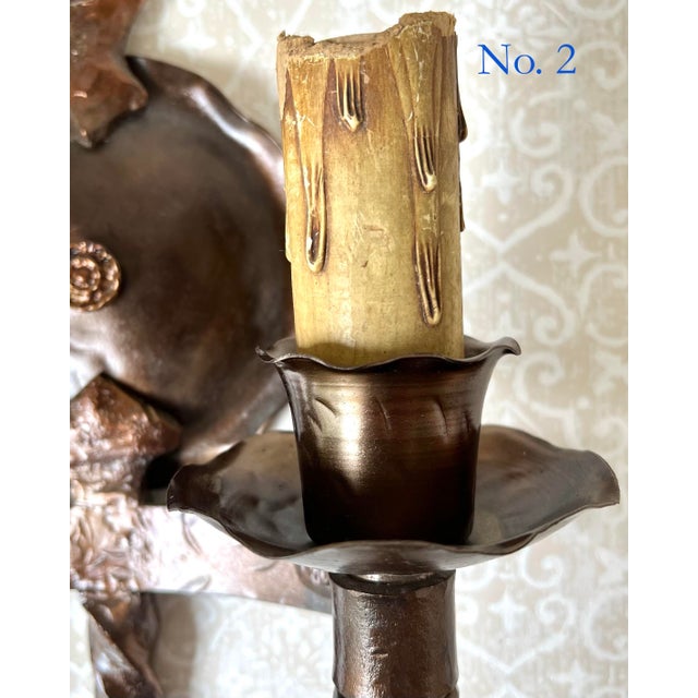 These exquisite antique bronze sconces, crafted from hammered and cast iron metal dating back to the 1920s, have been...