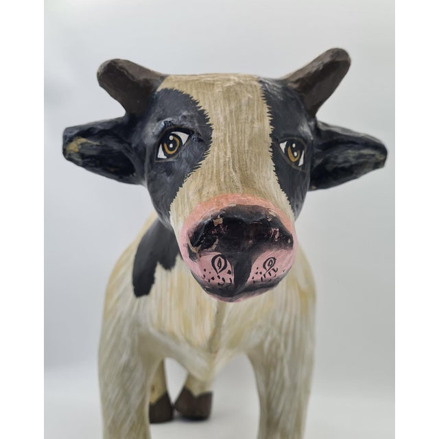 An original decorative cow figurine made of papier-mâché in the folk art style, dating from the second half of the 20th...