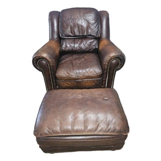 Perfectly Worn Leather & Studded Chair and Matching Ottoman For Sale