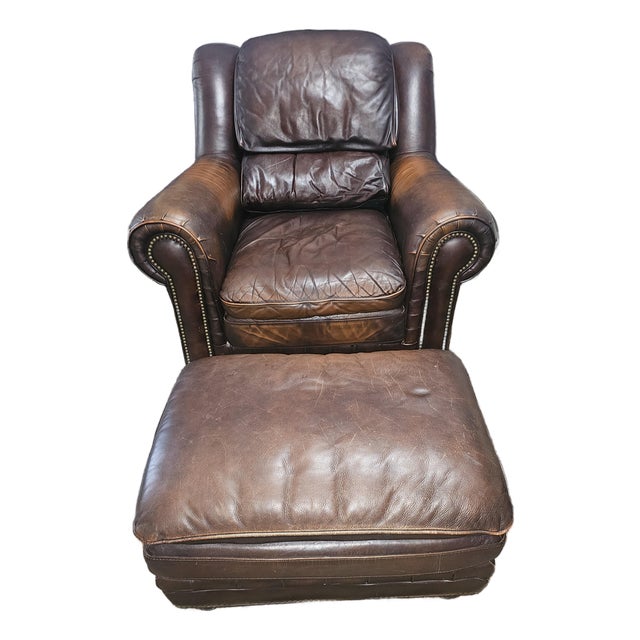 Perfectly Worn Leather & Studded Chair and Matching Ottoman For Sale