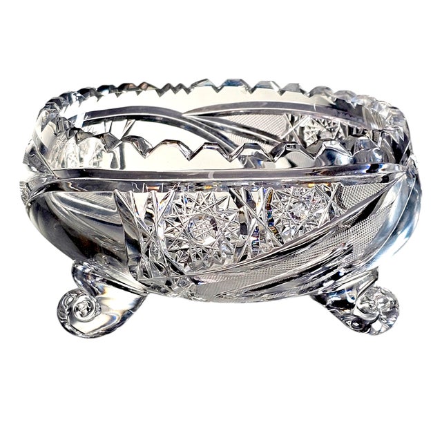 Light splinters into brilliance across cut crystal, the hobstar pattern catching and scattering every flicker. Resting on...