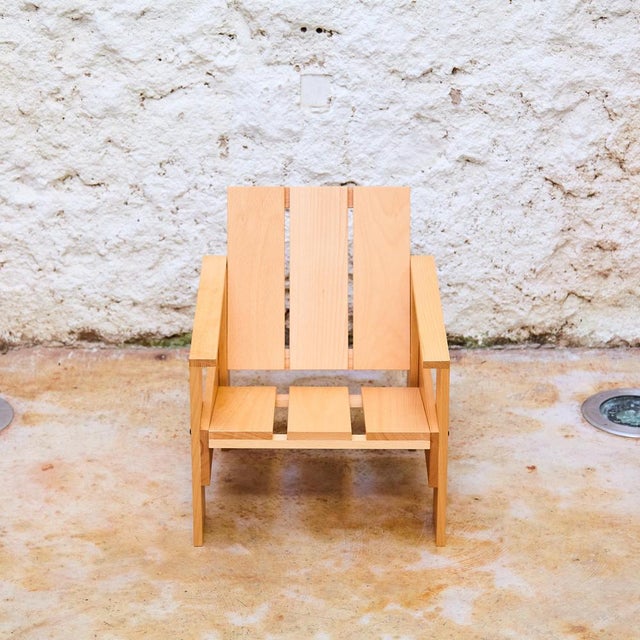 Low drawer chair in natural wood with lacquer for children by gerrit rietveld. Produced by rietveld family including...