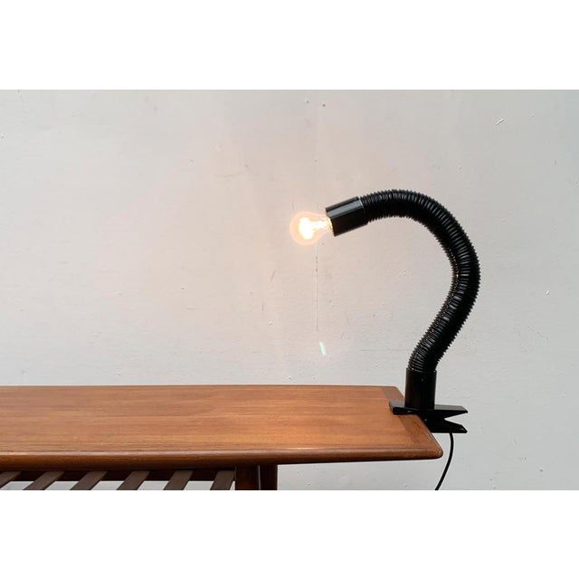 Space Age Schwanenhals table clamping lamp. The lamp shows a futuristic Space Age Design with a flexible neck made of a...