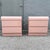 A striking pair of Postmodern waterfall nightstands finished in a soft blush pink gloss laminate, embodying the playful...