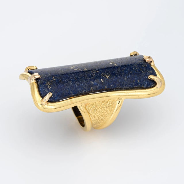 This is part of Chairish’s Fine Jewelry assortment. Stylish vintage lapis lazuli cocktail ring (circa 1960s to 1970s)...