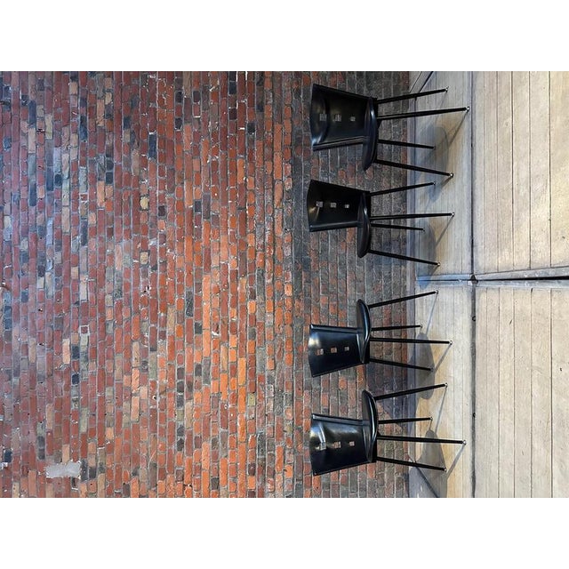 Set of 4 chairs from the 1960s in black leather. Black metal base, comfortable, very good overall condition. Seat height...