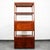 Freestanding teak shelving unit with storage. Finished on all sides so it can be used as a room divider. Features 2...