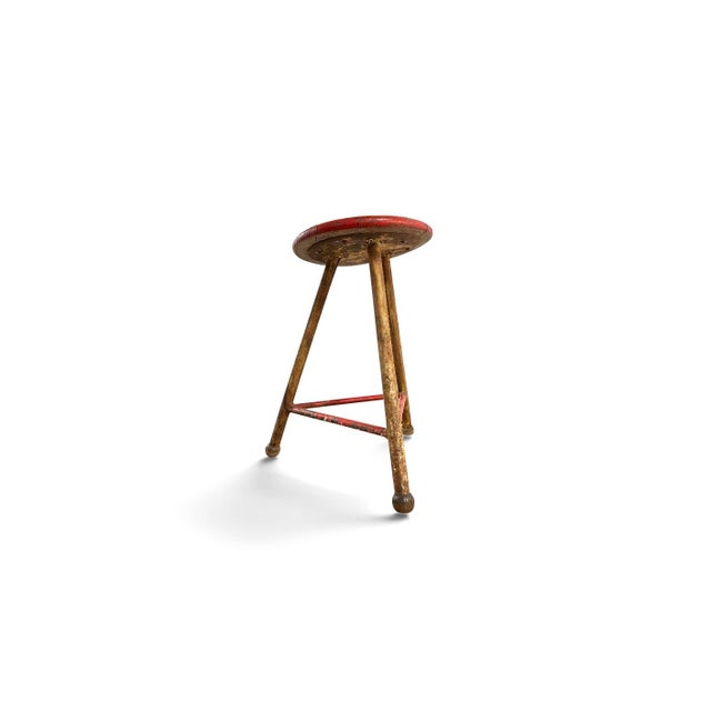 Industrial workshop stool executed in steel and wood, attributed to germany, early 20th century. the stool features a...