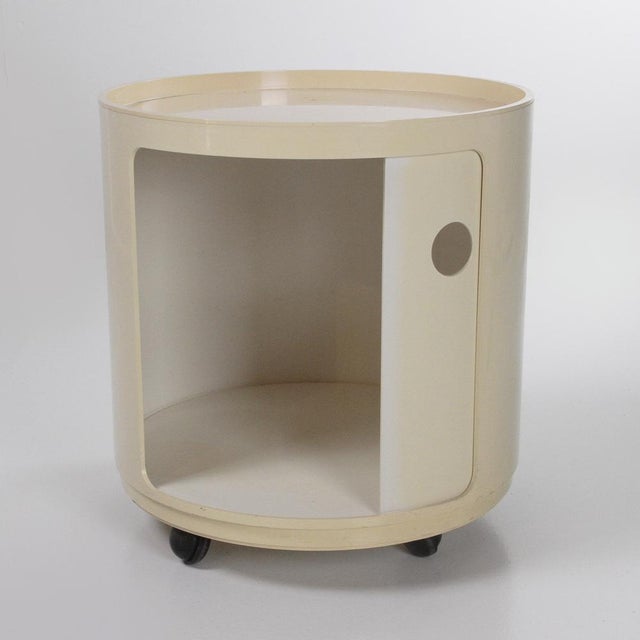 Cylindrical cabinet with wheels and a door from the 1970s. Designed by Anna Castelli and produced by Kartell. The plastic...