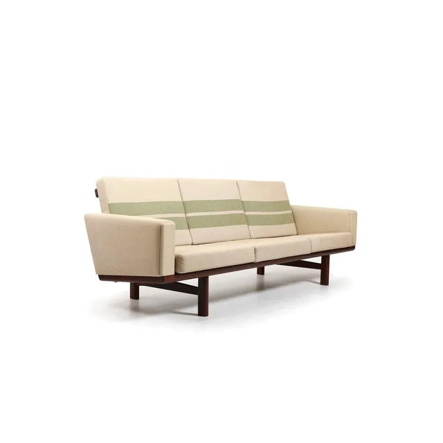 GE-236 / 3 sofa in solid teak, designed by Hans J. Wegner in 1955. Manufactured by Getama in 1960s. Original cushions in...