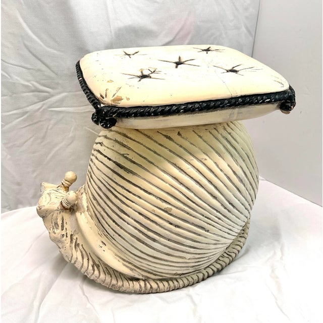 A wonderfully whimsical vintage Italian terracotta snail garden stool featuring sculptural shell detailing and a tufted...